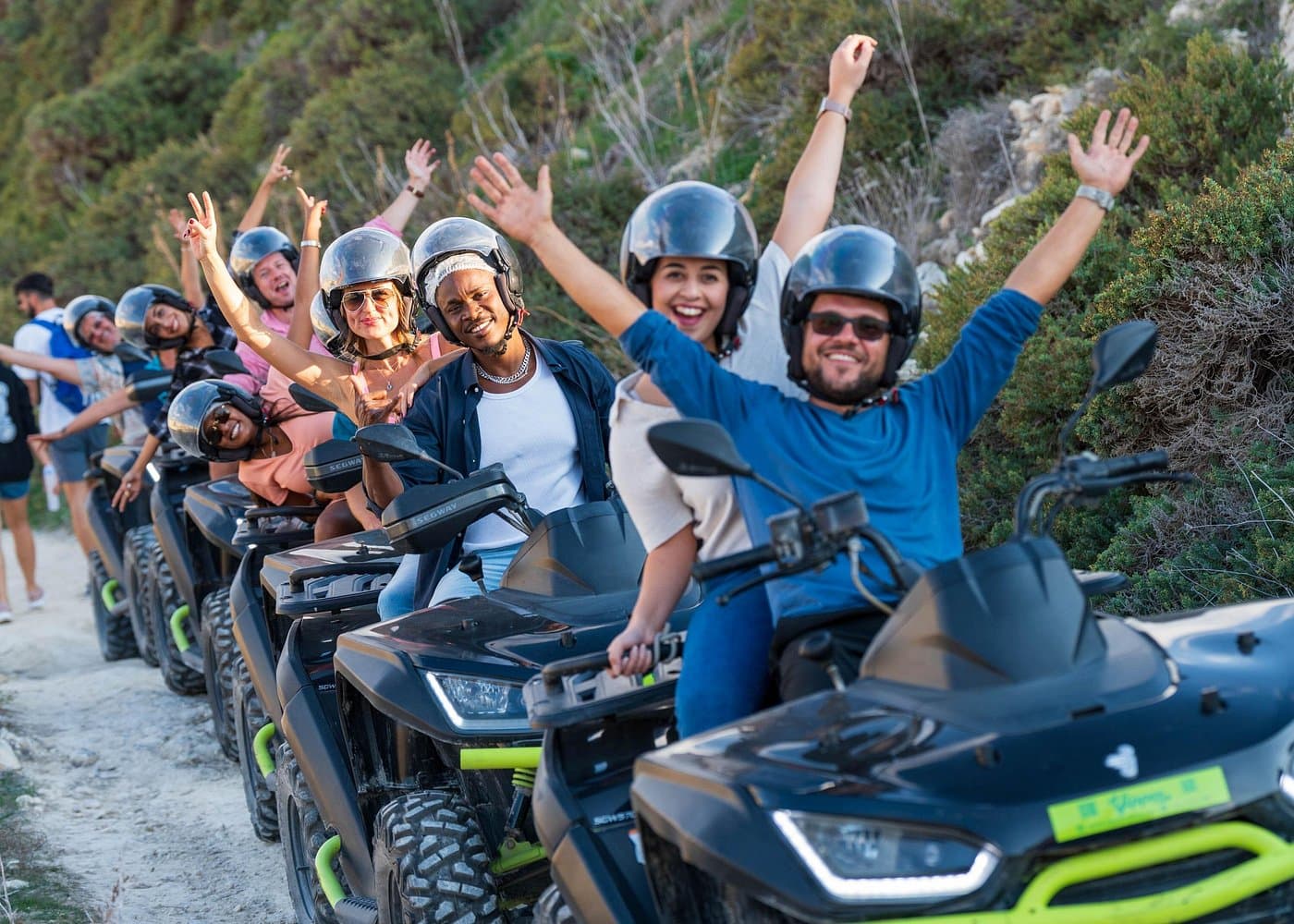 Riders on 570cc quads along a Gozo country trail.